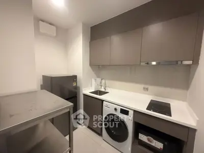 Modern kitchen with sleek appliances and ample storage space