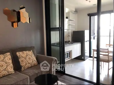 Modern living room with open kitchen and stylish decor in a bright apartment