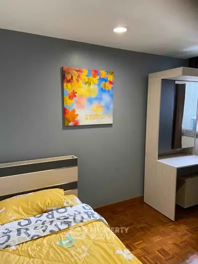 Cozy bedroom with modern decor and vibrant wall art