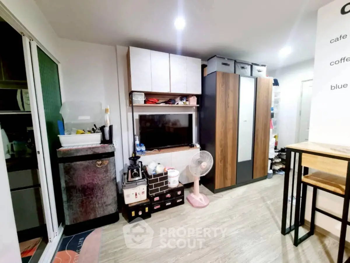 Cozy living room with modern furniture and ample storage space