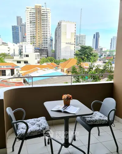 Charming balcony with city view, perfect for relaxation and enjoying the urban skyline.