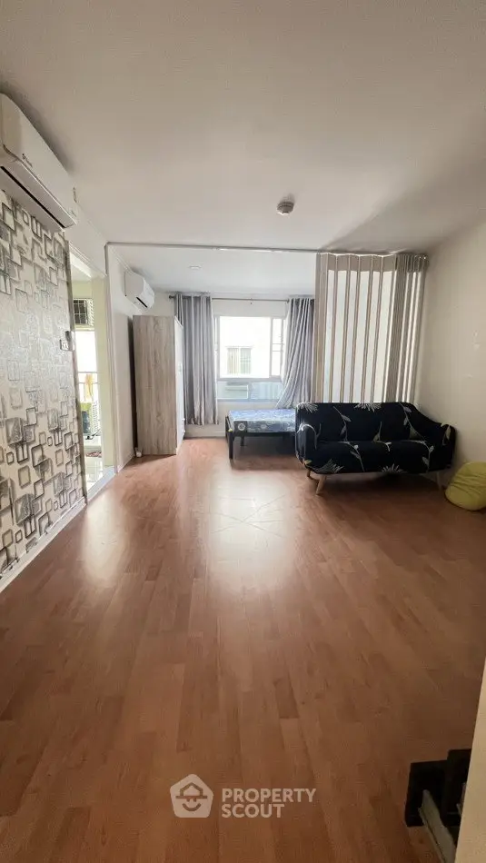 Spacious studio apartment with modern decor and natural light