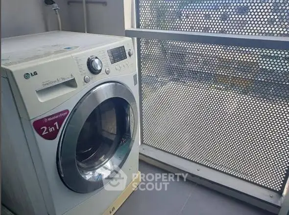 Modern apartment with a washing machine on a balcony, offering convenience and functionality.
