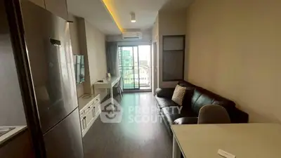 Modern living room with sleek furniture and balcony view in urban apartment