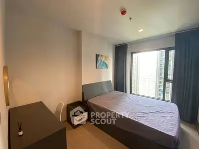 Modern bedroom with large window and city view, featuring sleek furniture and minimalist decor.