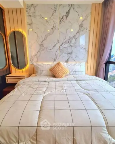 Luxurious bedroom with modern marble accent wall and city view