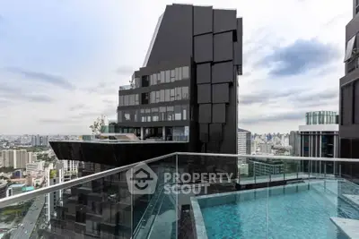 Luxurious rooftop pool with stunning cityscape views in modern high-rise building.
