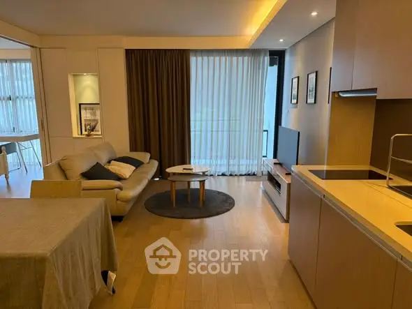 Modern living room with open kitchen and stylish decor