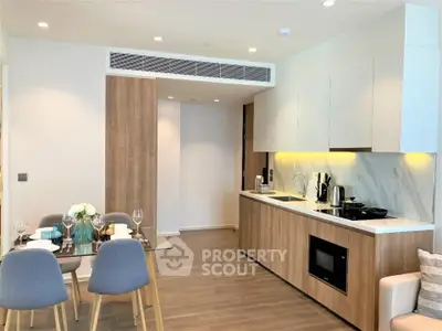 Modern open-layout kitchen with dining area and stylish decor