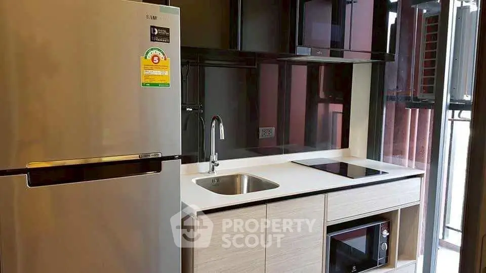 Modern kitchen with sleek appliances and stylish cabinetry