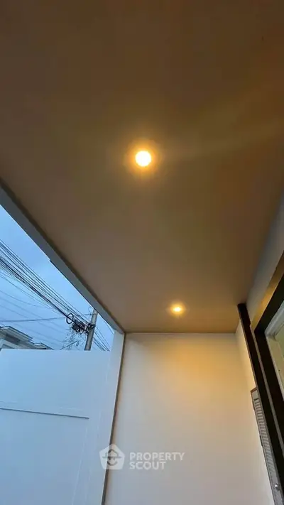 Modern balcony with recessed lighting and clean design