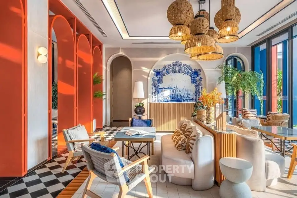 Luxurious living room with modern decor, vibrant colors, and stylish furniture in a high-end property.