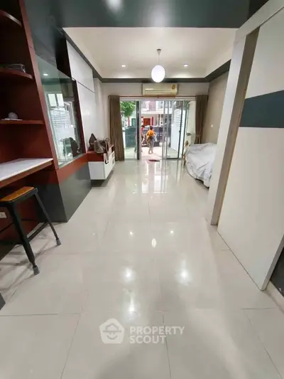 Spacious modern living area with sleek design and large windows for natural light.