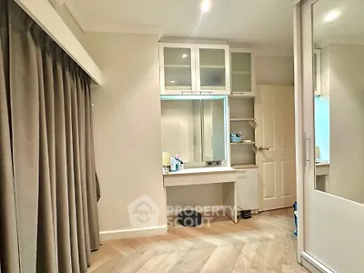 Modern bedroom with built-in storage and elegant wood flooring