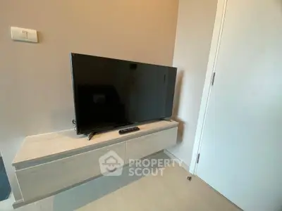 Modern living room with sleek TV setup and minimalist decor