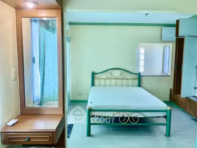 Cozy bedroom with elegant metal bed frame and built-in vanity, perfect for a serene retreat.