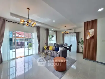 Spacious modern living room with elegant decor and large windows for natural light.