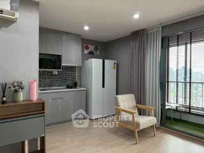 Modern apartment interior with stylish kitchen and cozy living area featuring large windows and city view.
