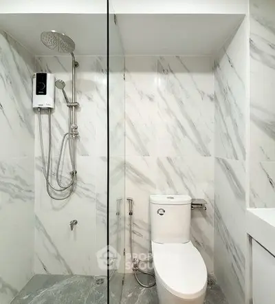 Modern bathroom with marble tiles and sleek shower design