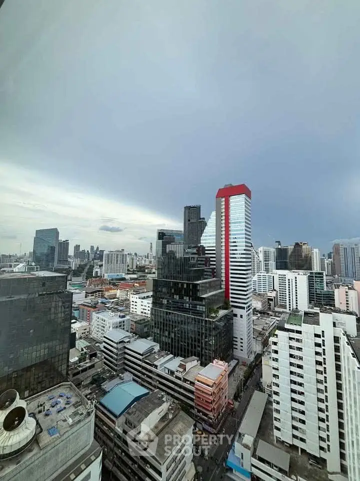 Stunning cityscape view from high-rise building showcasing modern urban architecture.