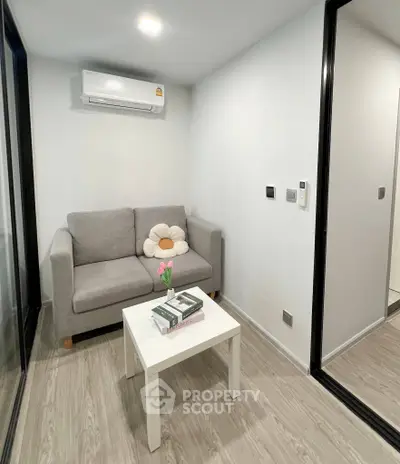 Cozy modern living room with gray sofa and minimalist decor