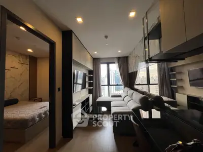 Modern living room with city view, stylish decor, and adjacent bedroom