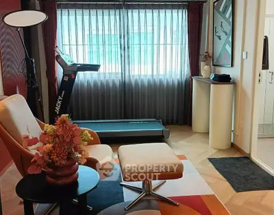 Stylish living room with modern decor and exercise equipment, perfect for a healthy lifestyle.