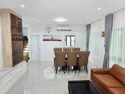 Spacious modern living room with elegant dining area and stylish decor