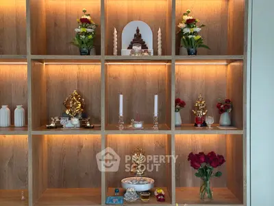 Elegant wooden display shelves with decorative items and soft lighting, perfect for enhancing living spaces.