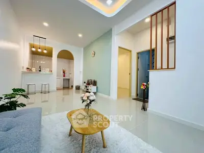 Modern living room with open kitchen and stylish decor