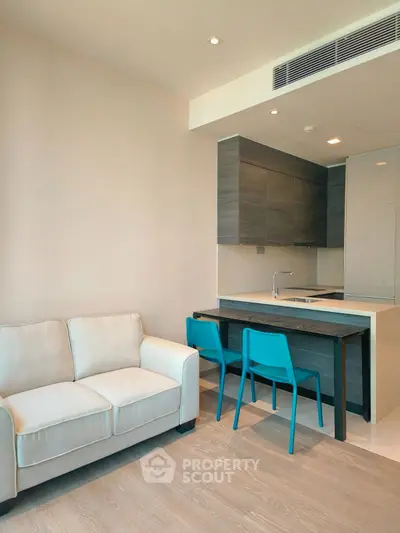 Modern open kitchen with sleek design and cozy living area