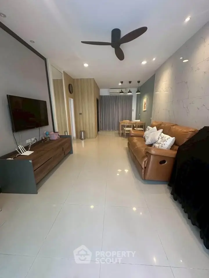 Spacious modern living room with sleek design and comfortable seating