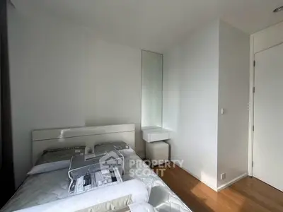 Modern minimalist bedroom with sleek design and natural light