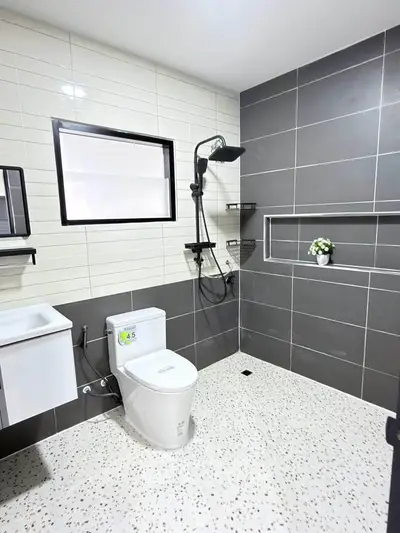 Modern bathroom with sleek gray tiles and contemporary fixtures