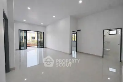 Spacious modern living room with large windows and open layout