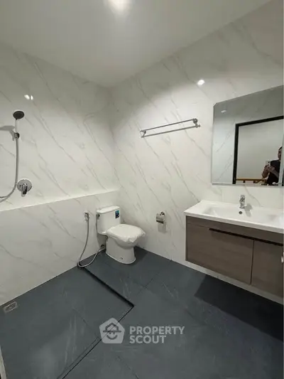 Modern bathroom with sleek fixtures and elegant marble walls