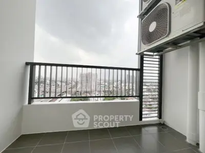 Modern balcony with city view and air conditioning unit, perfect for urban living.