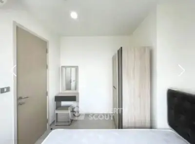 Modern minimalist bedroom with sleek furniture and neutral tones