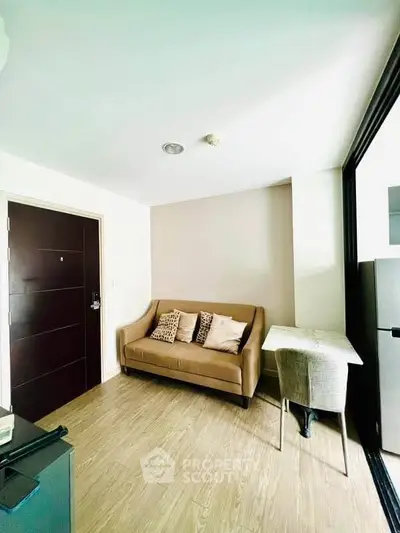 Modern living room with cozy sofa and stylish decor in a bright apartment.