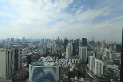 Stunning cityscape view from a high-rise building showcasing urban skyline and architectural diversity.
