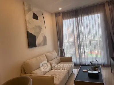 Modern living room with large window and stylish decor