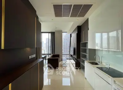 Luxurious modern apartment with sleek kitchen and spacious living area, offering stunning city views.