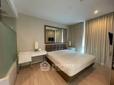 Modern bedroom with stylish decor and natural light