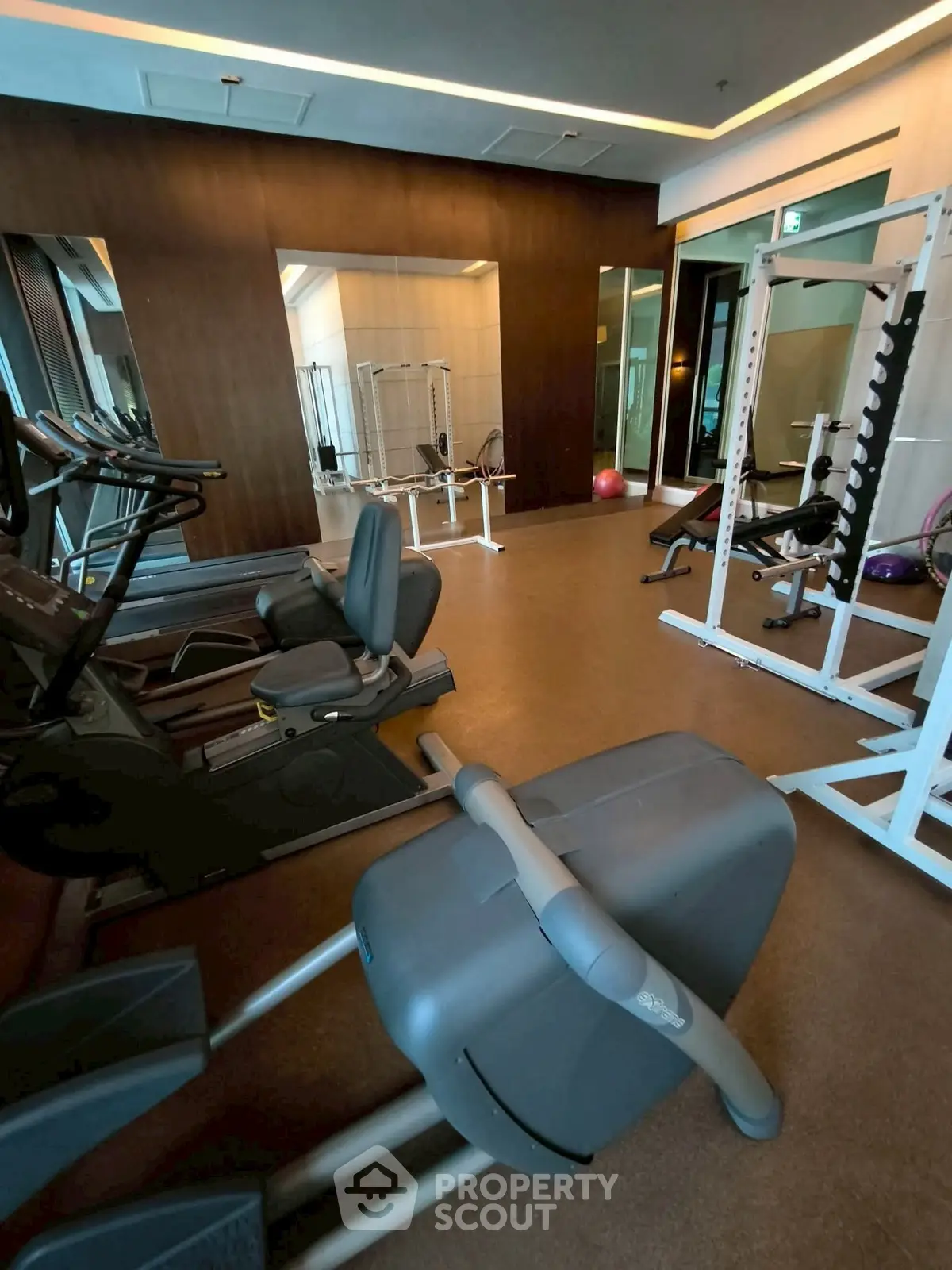 Modern gym with state-of-the-art equipment in luxury residential building