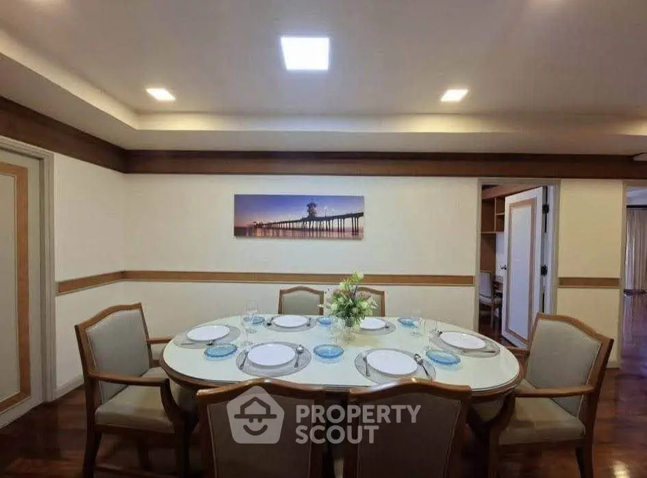 Elegant dining room with round table and stylish chairs, perfect for hosting dinner parties.