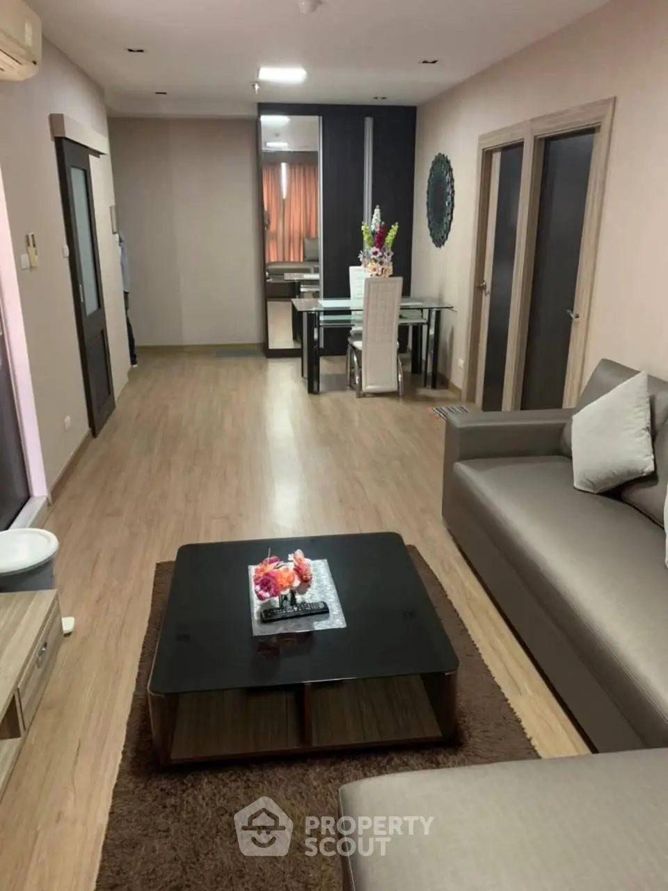 Spacious modern living room with elegant decor and dining area