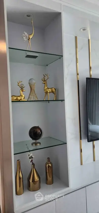 Elegant living room shelf with decorative gold accents and modern design