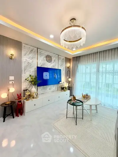 Luxurious living room with elegant chandelier and modern decor
