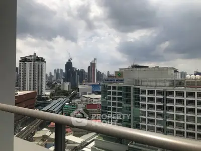 Stunning cityscape view from a high-rise balcony in urban setting.