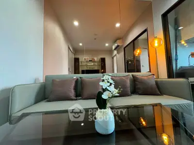 Modern living room with stylish sofa and elegant decor in a contemporary apartment.